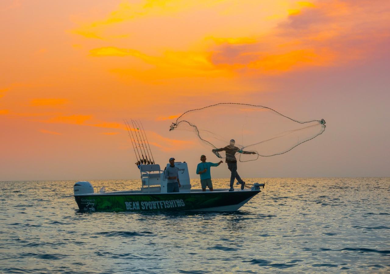 Bean sportsfishing boat with a sunset.