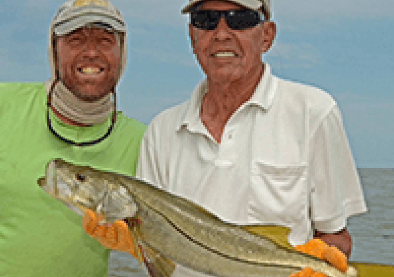 captain scott holding a fish