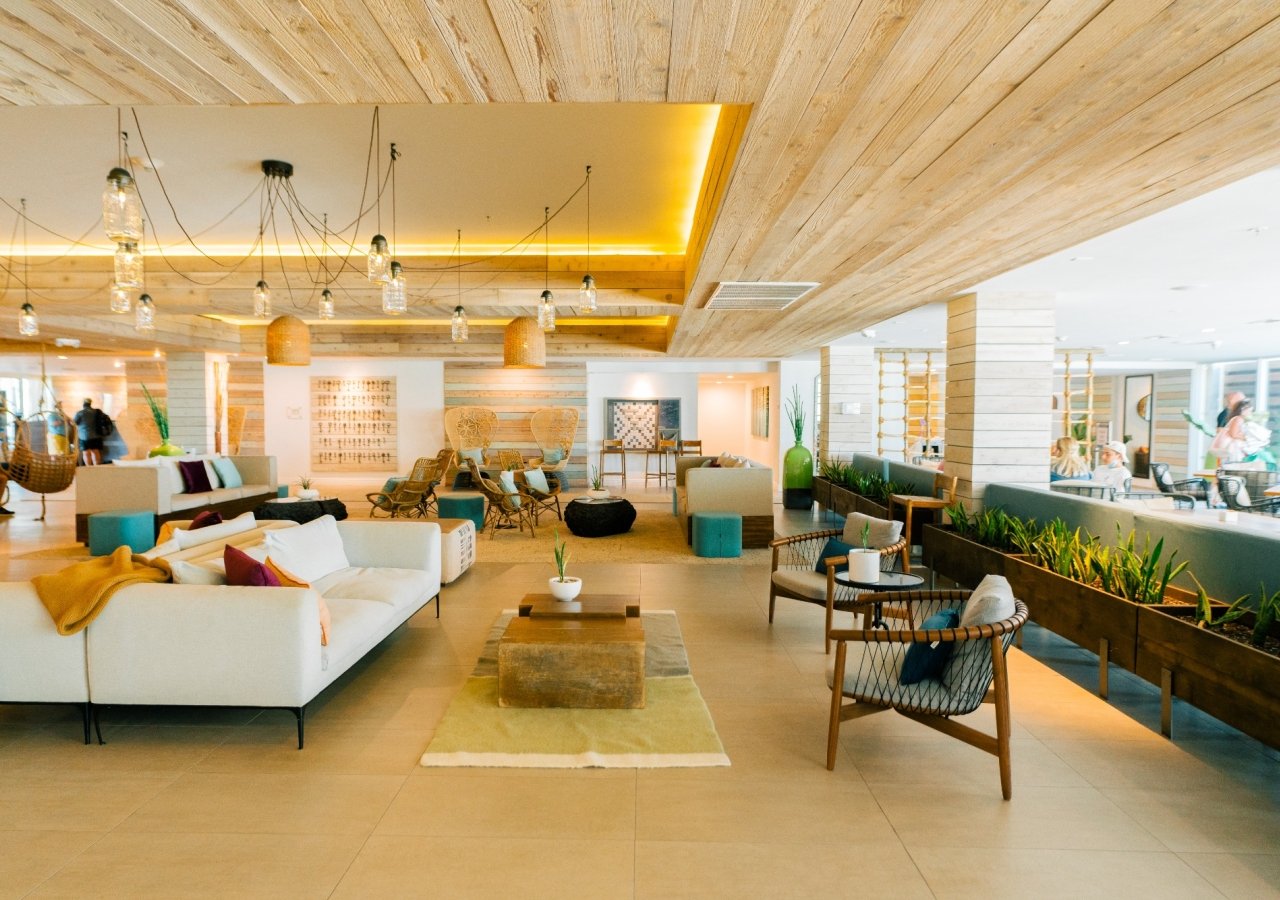 The lobby at Amara Cay, with couches and large windows