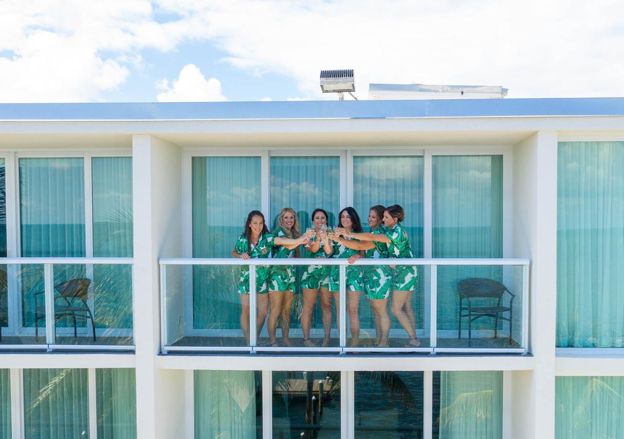 bridal party on the balcony of the hotel