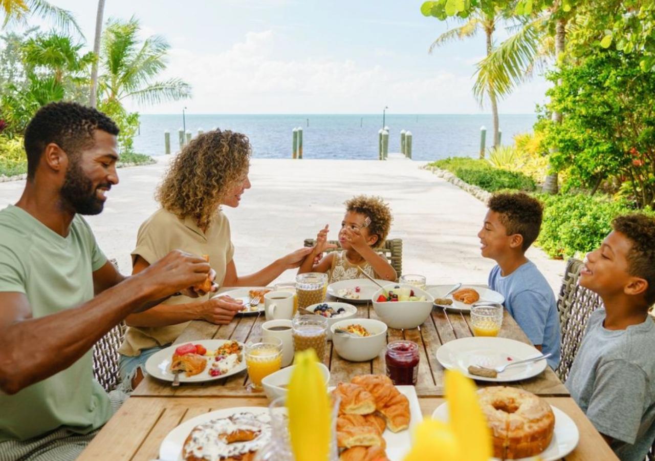 Family sitting at marbella villa eating breakfast