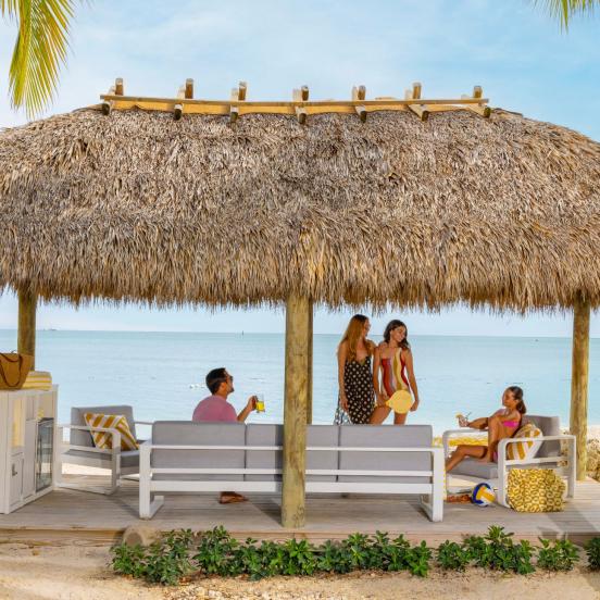 People at a cabana on the beach