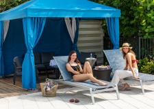 Amara Cay - Women hanging out at pool 