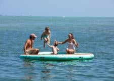 Three Waters Resort - people jumping on a water trampoline 